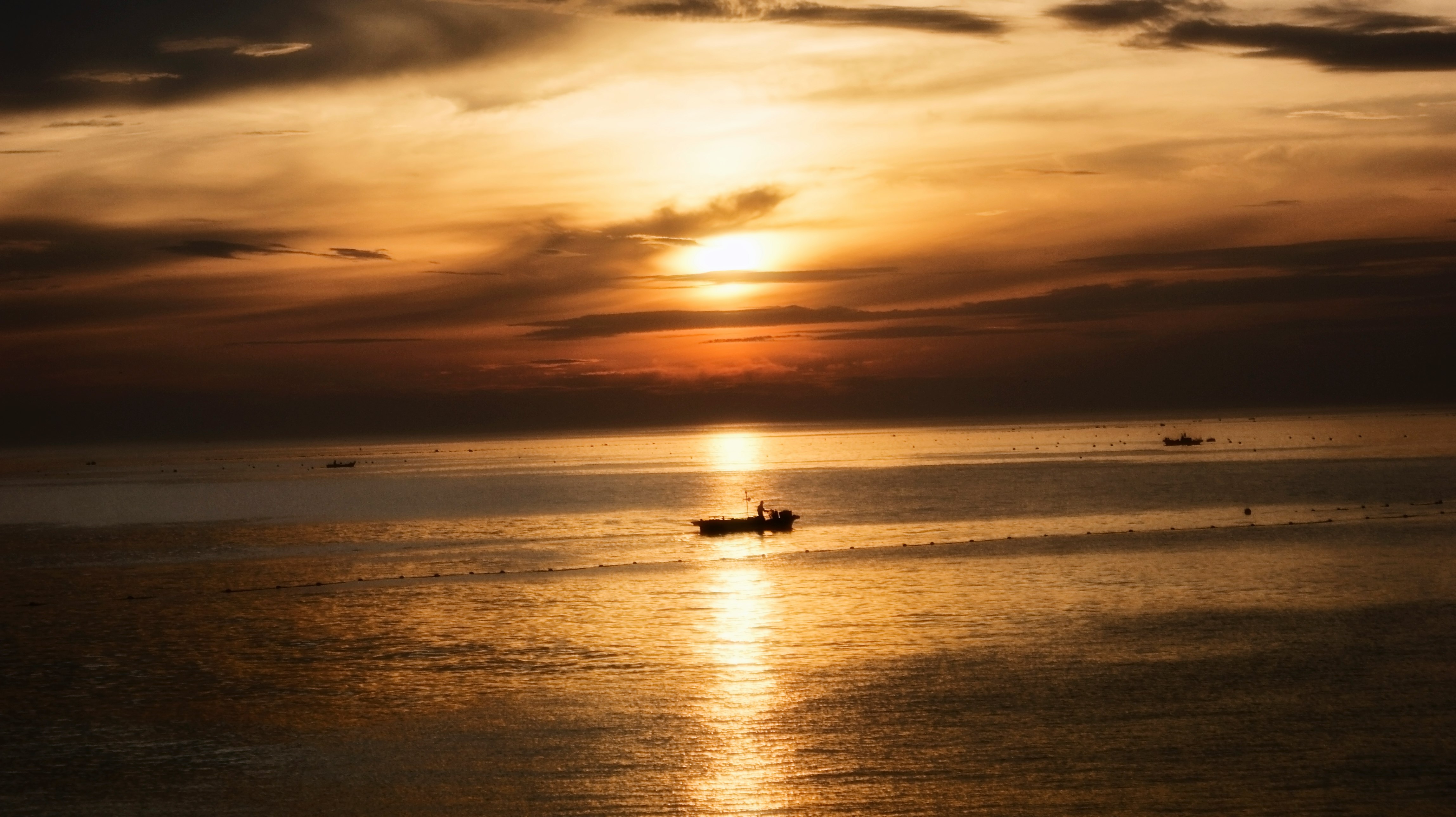 silhouette of boat during dusk